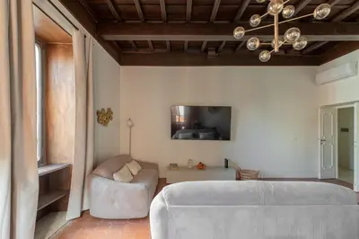 a living room with a couch and a tv at iFlat Trastevere Life with Beauty, Elegance & SPA in Rome