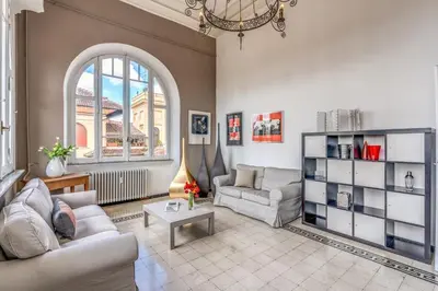 a living room with a couch and a table at Napoleone 2 bedroom apartment in Rome