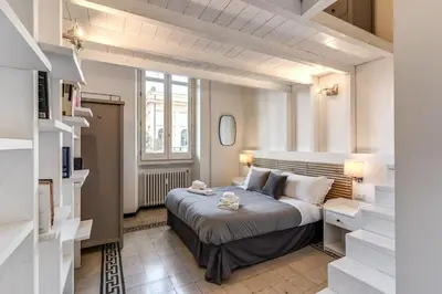 a bedroom with a large bed in a room at Napoleone 2 bedroom apartment in Rome
