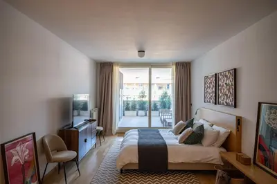 a bedroom with a bed and a television in it at La Dolce Vita - Trastevere Luxury Stylish Studio in Rome
