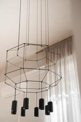 a metal chandelier hanging from a ceiling at Vittorio Emanuele Grand Apartment in Rome