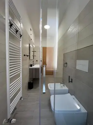 a bathroom with a toilet and a sink at Appartamento Amy House in Rome
