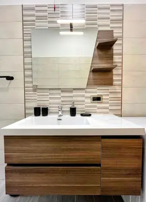 a bathroom with a sink and a mirror at Appartamento Amy House in Rome
