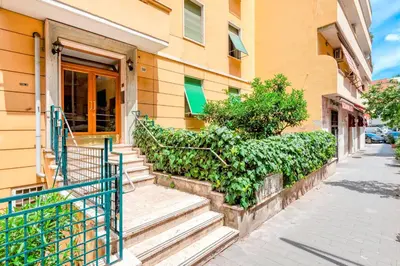 a building with stairs in front of a building at Appartamento Amy House in Rome