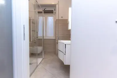 a bathroom with a shower and a sink and a toilet at Casa Arco in Rome