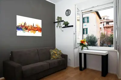 a living room with a couch and a window at Casetta Garbatella in Rome
