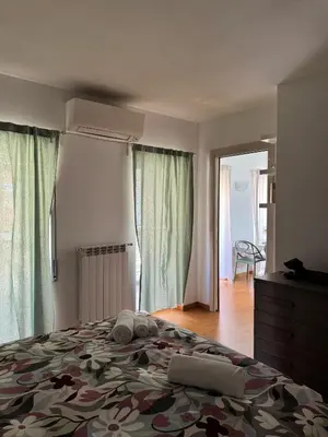 a bedroom with a large bed with towels on it at Splendido Attico con Terrazza a Trastevere in Rome