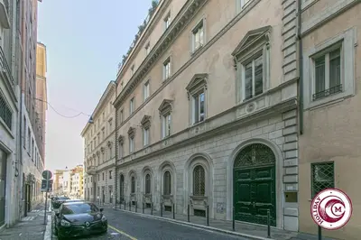 a car parked on a street next to a building at C M Barberini Vacation in Rome