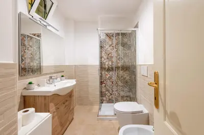 a bathroom with a shower and a sink and a toilet at Loft nel Cuore della Capitale in Rome