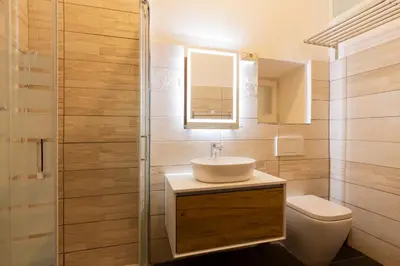 a bathroom with a sink and a toilet at Alma Musa Piazza Bologna Apartment in Rome