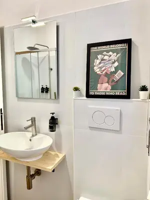 a bathroom with a sink and a mirror at SarHome in Rome