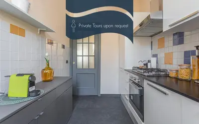 a kitchen with a counter with a toaster on it at Daplace - Cosima Apartment III in Rome