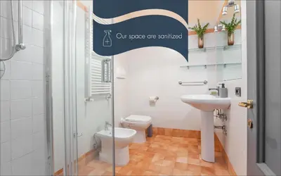 a bathroom with a toilet and a sink at Daplace - Cosima Apartment III in Rome