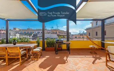 a patio with a table and chairs and a view at Daplace - Cosima Apartment III in Rome