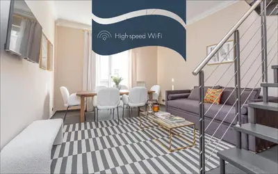 a living room with a couch and a table at Daplace - Cosima Apartment III in Rome