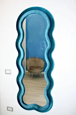 a wall mural of a living room with a blue wave at Terrazza Majorana in Rome