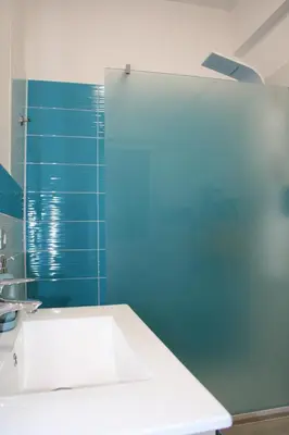 a bathroom with a sink and a blue wall at Terrazza Majorana in Rome