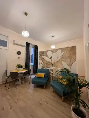 a living room with a couch and a table at Suite Crescenzio in Laterano in Rome