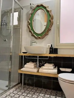 a bathroom with a sink and a mirror at Suite Crescenzio in Laterano in Rome