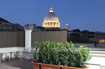 a building with a domed building in the background at L'Isola di Esme in Rome
