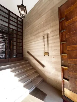 a hallway with stairs and a wooden wall at Roma Parioli Suite Green Harmony in Rome