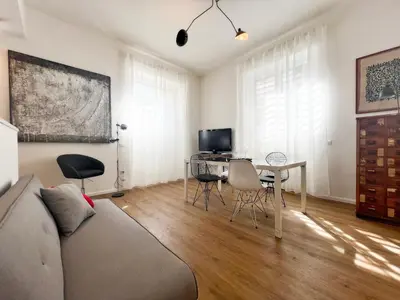 a living room with a couch and a table at Roma Parioli - Loft Style in Rome