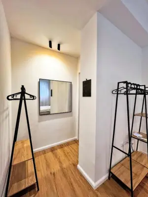 a room with two tall stands in front of a wall at Roma Parioli - Loft Style in Rome