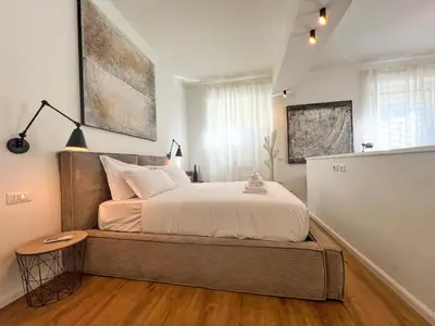 a bedroom with a large bed in a room at Roma Parioli - Loft Style in Rome