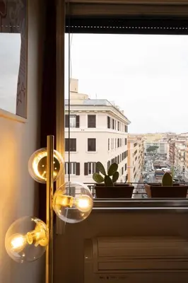 a window with a view of a city at La Spezia House in Rome