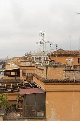 a group of roofs of buildings in a city at La Spezia House in Rome