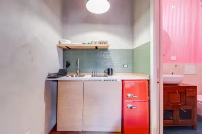 a small kitchen with a sink and a sink at garden studio apartment in Rome