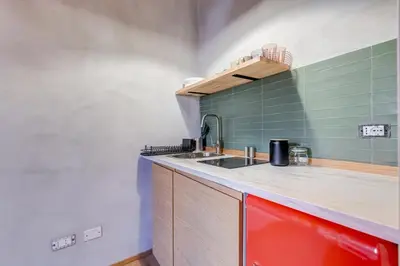 a kitchen with a sink and a counter at garden studio apartment in Rome