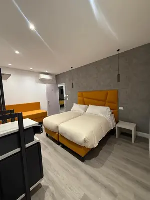 a bedroom with a large bed in a room at FoffoSuite in Rome