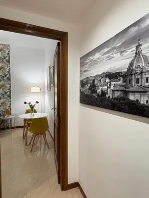 a room with a table and a painting on the wall at Cortile di Testaccio in Rome