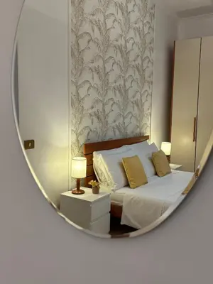 a bedroom with a bed in a mirror at Cortile di Testaccio in Rome