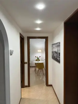 a hallway with a table and a dining room at Cortile di Testaccio in Rome