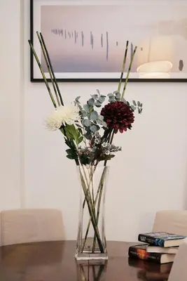 a vase filled with flowers sitting on a table at NEW - La Casetta di Nadia in Rome