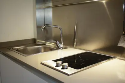 a kitchen counter with a sink and a sink at Regina Cappellari - Elegante dimora nel cuore di Roma in Rome