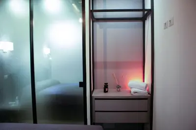 a room with a bed and a glass door at Regina Cappellari - Elegante dimora nel cuore di Roma in Rome