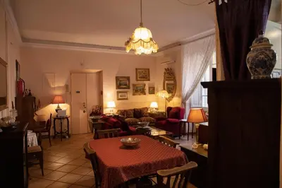 a living room with a table and a couch at Antonietta's Home in Rome