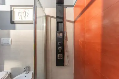 a bathroom with a shower and a toilet and a sink at Gianicolo Secret Garden Suite in Rome