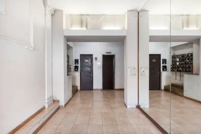 a large room with doors and a tile floor at Yellow Studio in Rome