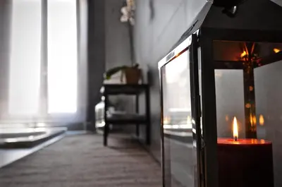 a candle sitting on a table in a room at Place 24 Suites & Wellness in Rome