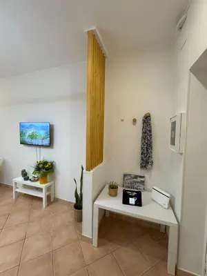 a room with two white tables and a window at Milena's Home Rome Center in Rome