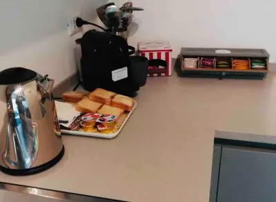 a counter top with a plate of food and a blender at Roma City Suite with Parking - Villa Borghese in Rome