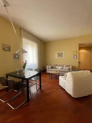 a living room with a couch and a table at San Giovanni Apartment Rome in Rome