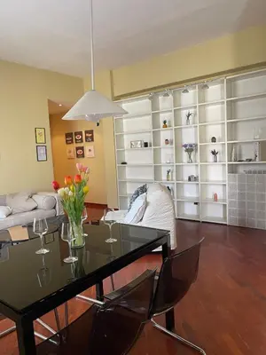 a living room with a table and a couch at San Giovanni Apartment Rome in Rome