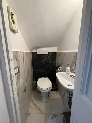 a small bathroom with a toilet and a sink at Rome Nest at Campo De Fiori and Navona Square in Rome