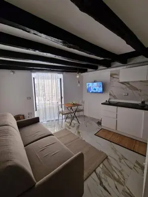 a living room with a couch and a table at Rome Nest at Campo De Fiori and Navona Square in Rome