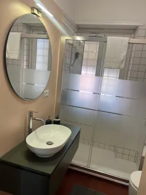 a bathroom with a sink and a mirror at Panoramic penthouse 10m from metro A in Rome